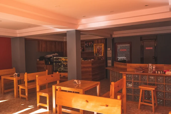 View through the cafe window to a mountain scene