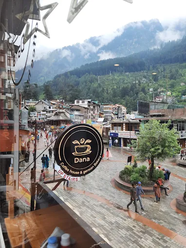 A person reading a book with a coffee